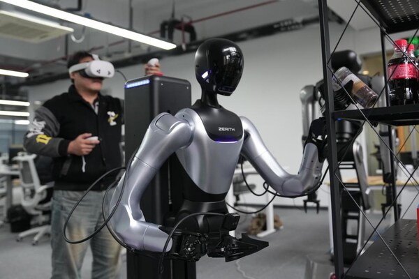 A technician debugs a humanoid robot at a company in Ningbo, east China's Zhejiang Province, March 26, 2026. (Xinhua/Huang Zongzhi)